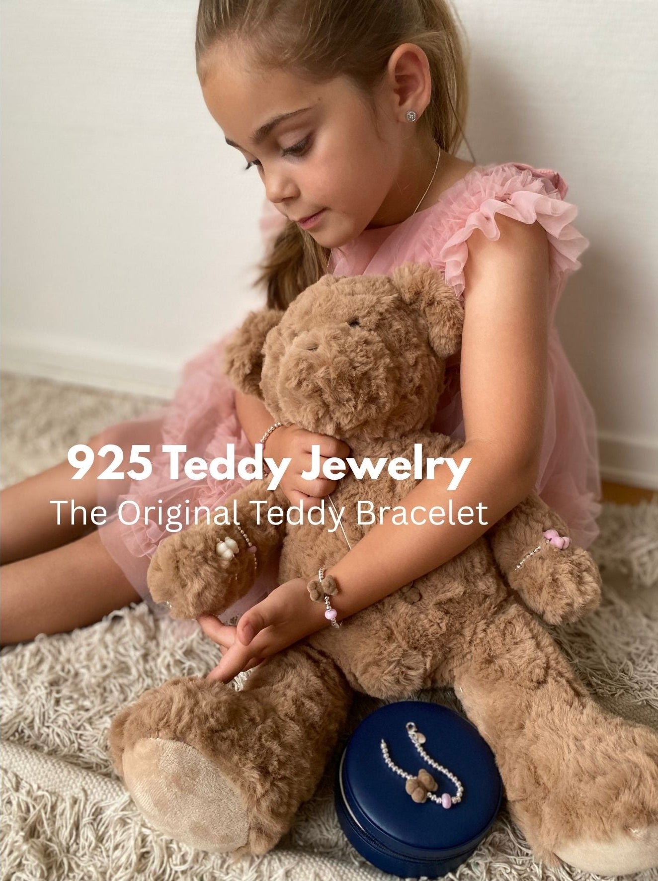 girl with a teddy bear and silver jewelry